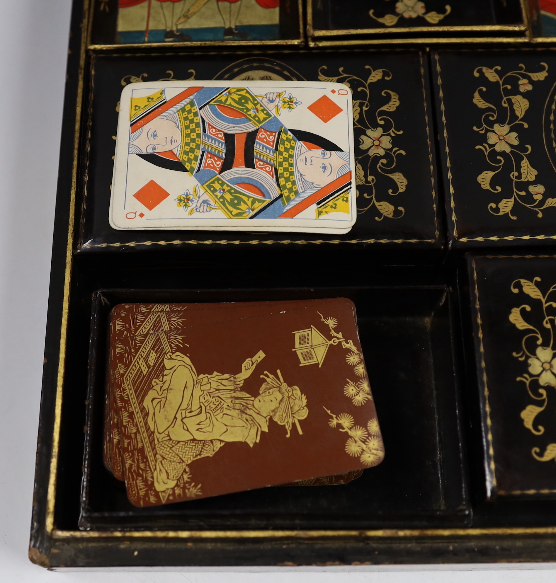 A mid 19th century Chinese export lacquer games box, containing mother of pearl counters